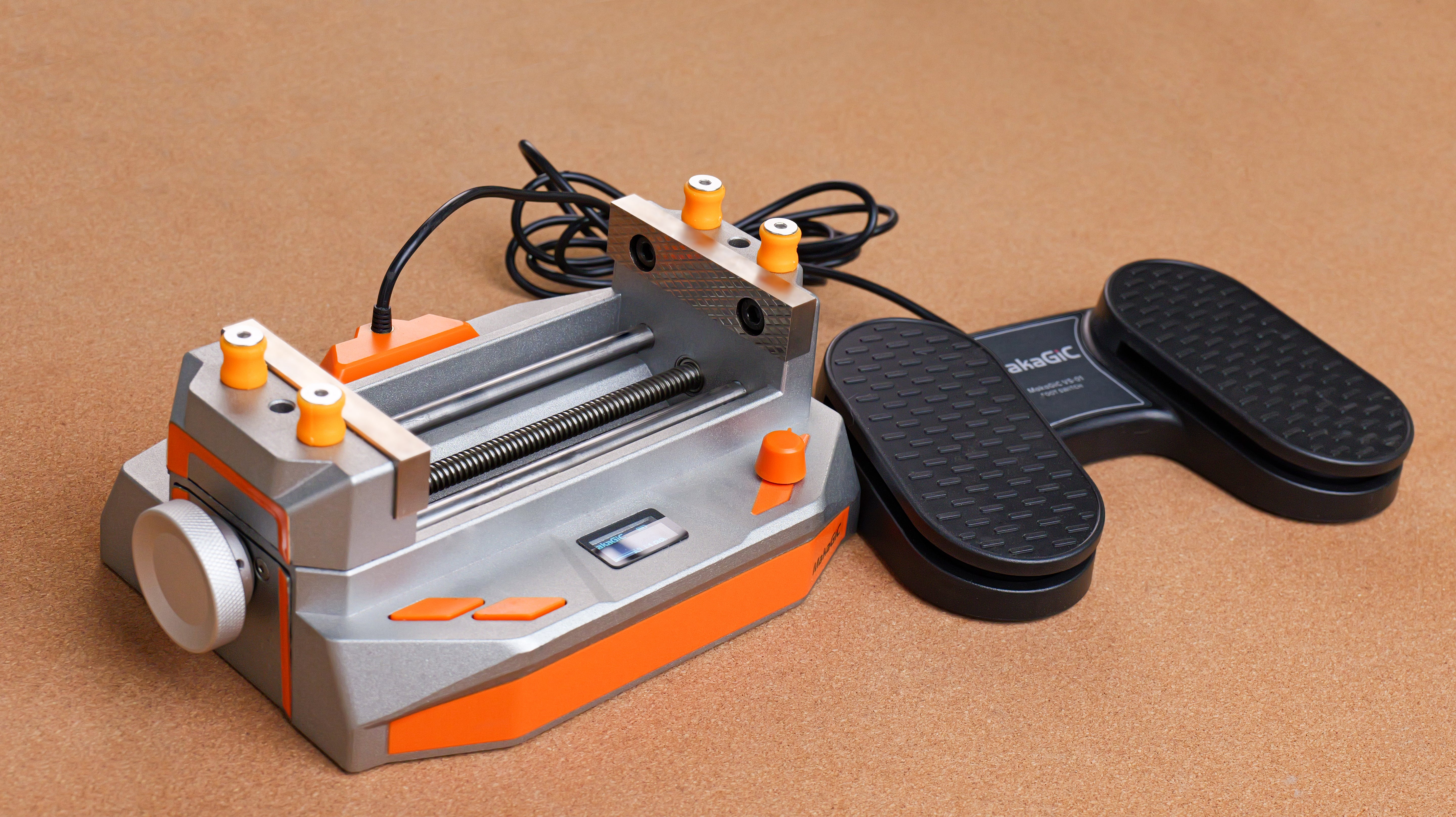 makagic vs01 smart vise and foot switch with black and metallic design.